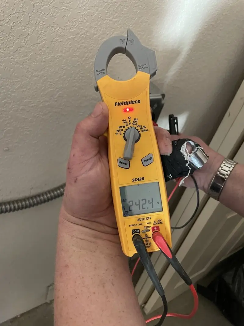 Voltage testing with clamp meter during Outlet Installation in New River